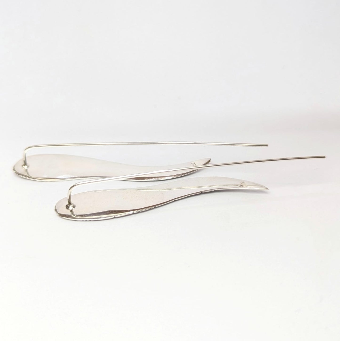 Aretes de pluma larga