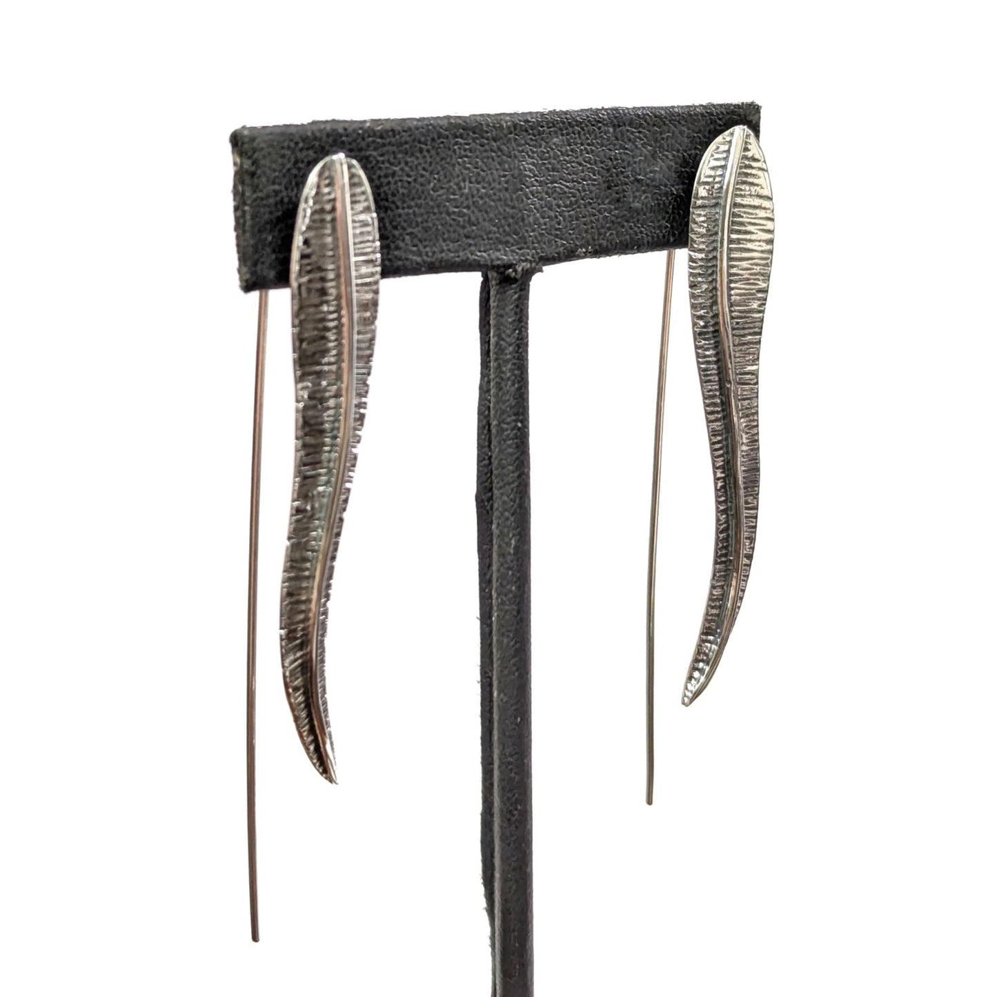 Aretes de pluma larga