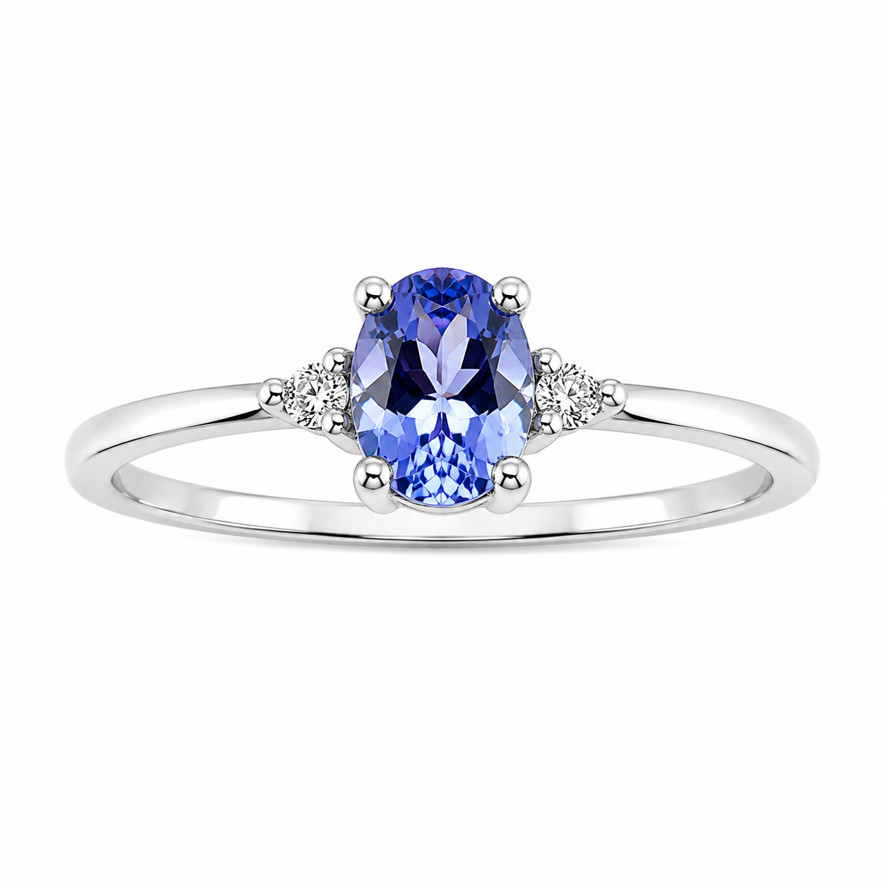 Anillo con tanzanita ovalado 4x5mm y 2 diamantes